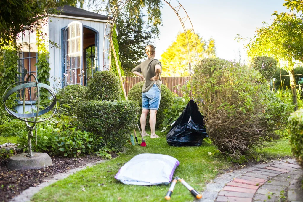 Woman cleaning yard